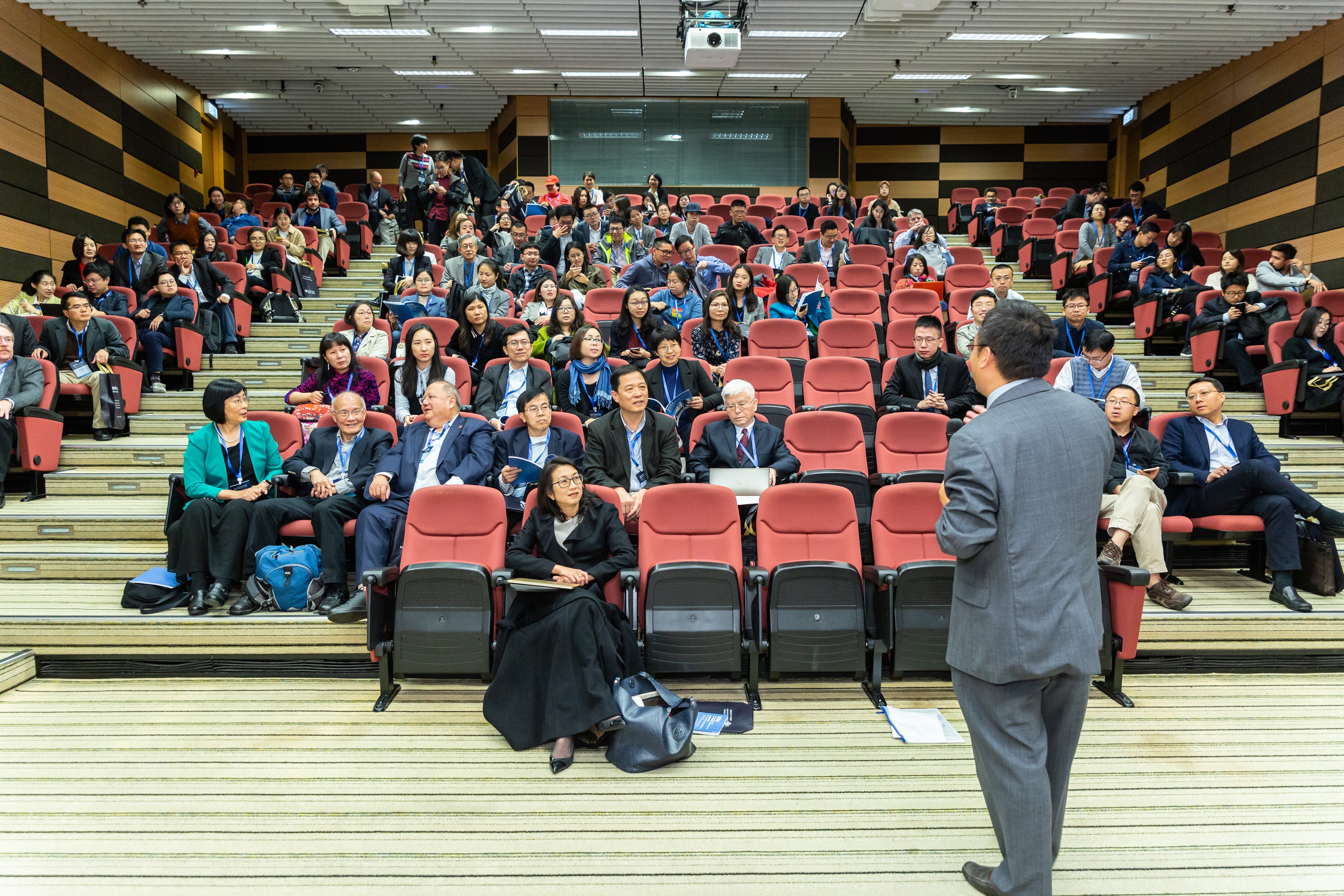 Man Standing In Front Of People